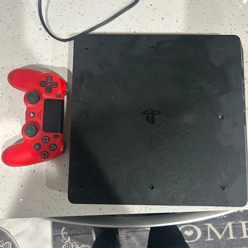 Sony Black Console with Red Controller